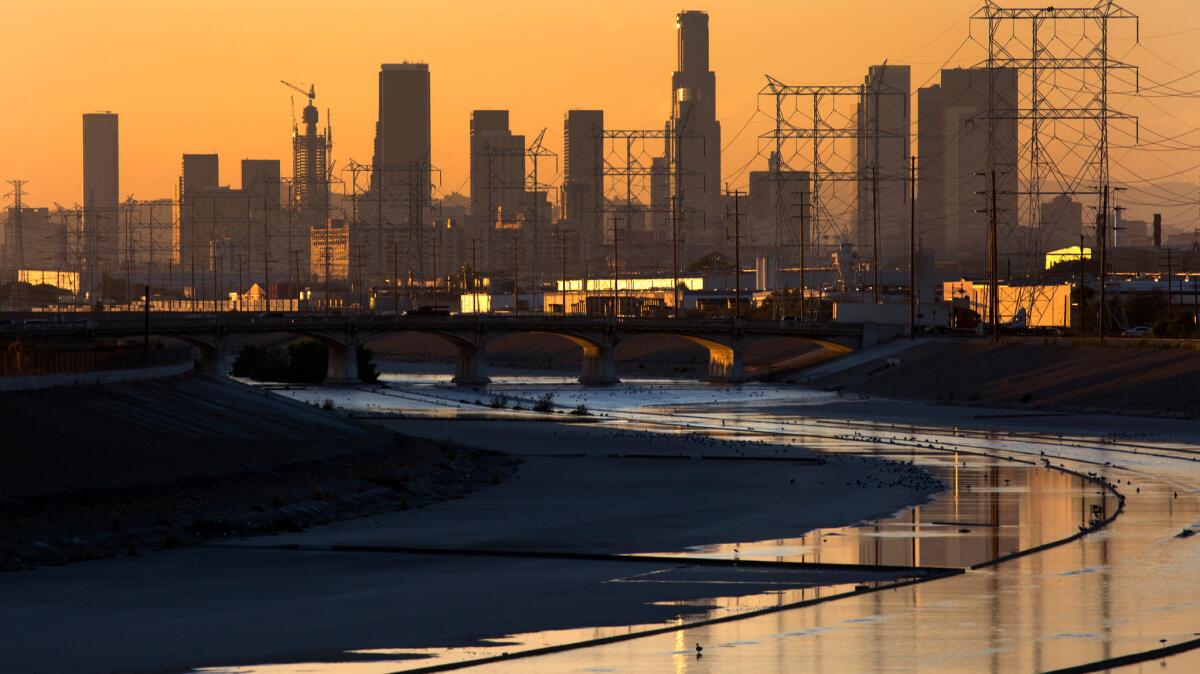 A view toward downtown Los Angeles shows the L.A. River in Maywood, Calif., on Sept. 30, 2015.