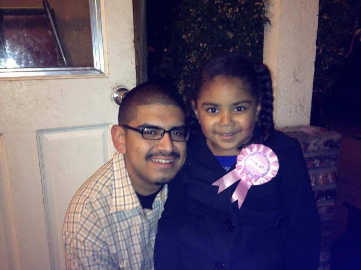 Francisco Garcia, 26, with his young daughter.