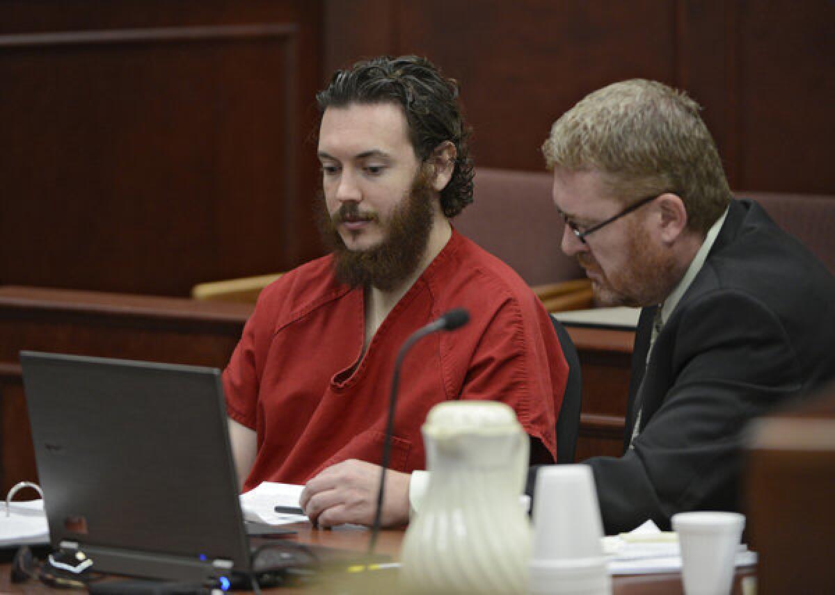 Defense attorney Daniel King, right, and Aurora, Colo., theater shooting suspect James Holmes review documents in court on June 4.
