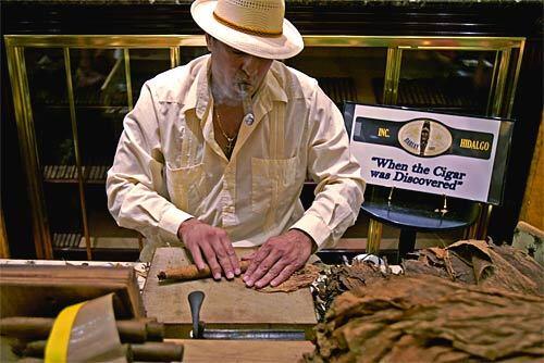 Cesar Ramirez hand rolls cigars at Havana Republic in the Miracle Mile shopping promenade. At this shop, you can enjoy one of his best cigars and watch him roll them.