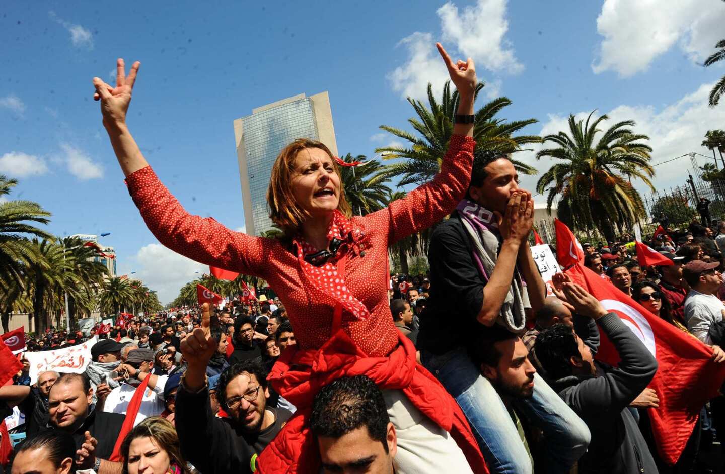 Tunisian doctor and human rights defender Amna Mnif, center, is among the protesters who showed up Monday for a Martyrs' Day rally in Tunisia's capital Tunis, despite a ban on demonstrations there.