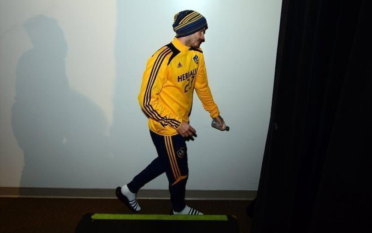 David Beckham of the Galaxy leaves after a news conference at the Home Depot Center on Nov. 20.