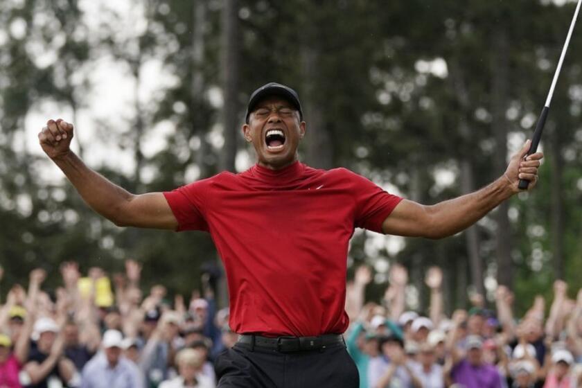 FILE - In this Sunday, April 14, 2019, file photo, Tiger Woods reacts as he wins the Masters golf tournament in Augusta, Ga. Woods goes for his next major on May 16 when the PGA Championship starts at Bethpage Black. (AP Photo/David J. Phillip, File)