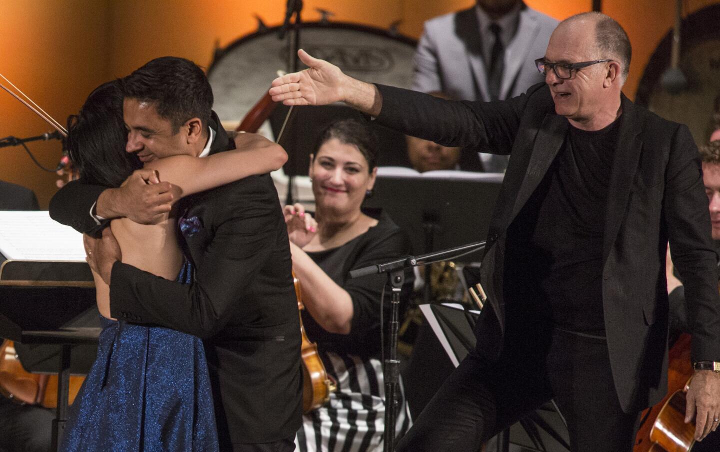 Conductor Steven Schick acknowledges Vijay Iyer as he hugs violinist Jennifer Koh after performance of Iyer's "Trouble" at the Ojai Music Festival's opening night June 8, 2017.