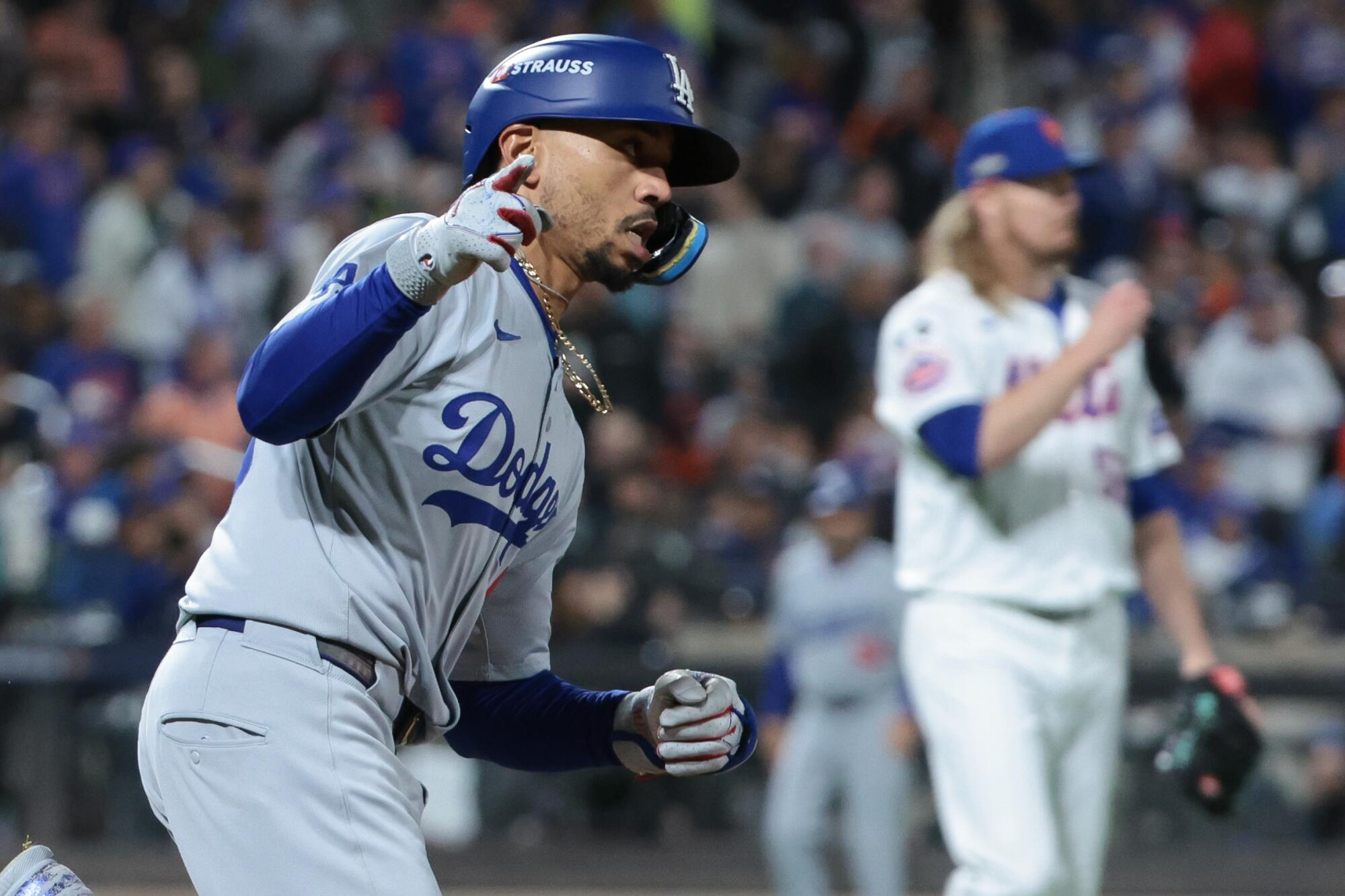 Mookie Betts circles the bases after hitting a home run in the sixth inning of the Dodgers' 12-6 loss.