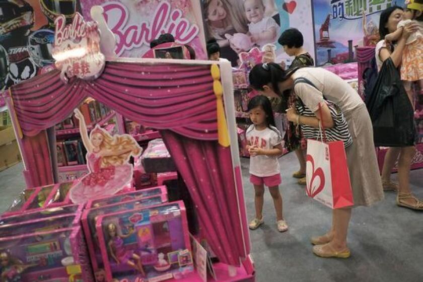Barbie toys on display in Beijing. Mattel earnings for the holiday season disappointed the company and analysts.