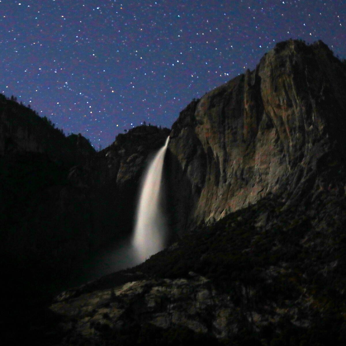 Yosemite Falls under a starry sky. 