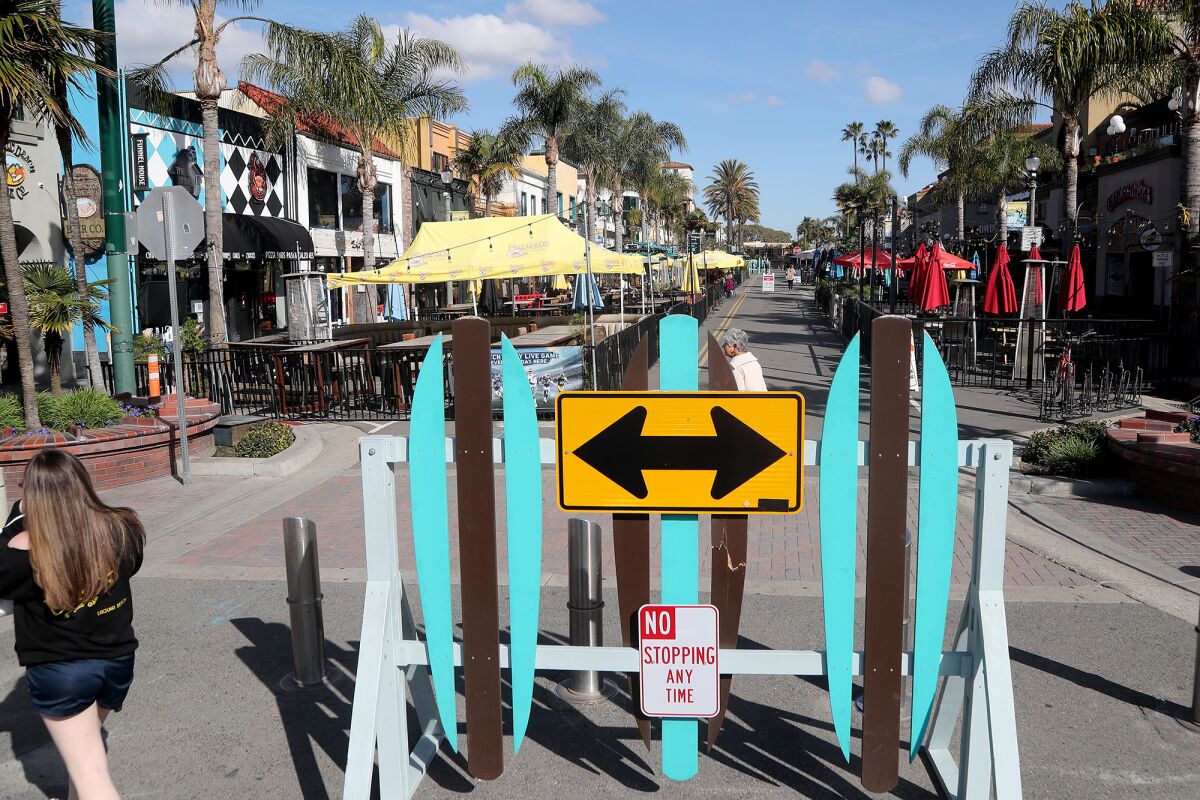 A barrier prevents motorists' access along the second block of Main Street in Huntington Beach on Wednesday.