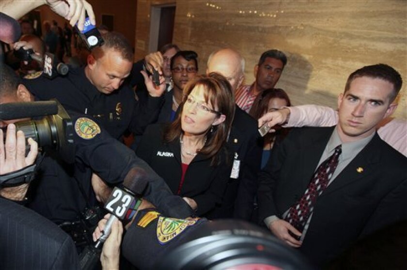 Alaska Gov. Sarah Palin speaks to the media as she arrives at the 2008 Republican Governors Association meeting in Miami, Fla., Wednesday, Nov. 12, 2008. Palin, who clearly is looking ahead to her political prospects in 2012, said Wednesday that a woman would be good for the Republican presidential ticket in four years. (AP Photo John Watson-Riley)