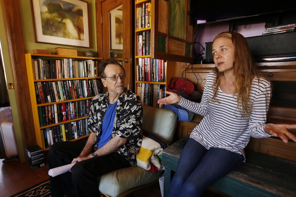 Tenants Bruce Kijewski, left, and Kelly Day talk about their concerns with short-term rentals at the Ellison in Venice on Sept. 11, 2018.