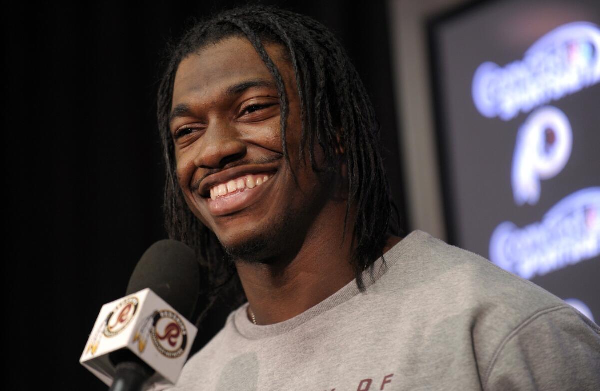 It didn't take long for Robert Griffin III to make the transition from Heisman Trophy winner at Baylor to NFL star with the Redskins. He faces another rookie in his first playoff game.
