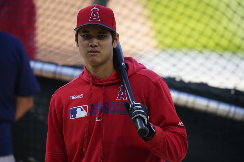 Los Angeles Angels designated hitter Shohei Ohtani (17) warms up before a baseball game.