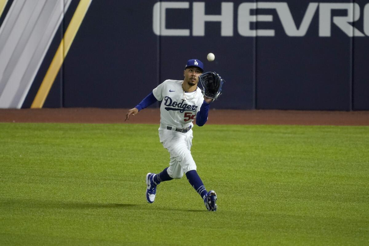 Dodgers right fielder Mookie Betts makes a catch against the San Diego Padres in Game 1 of the NLDS on Oct. 6.