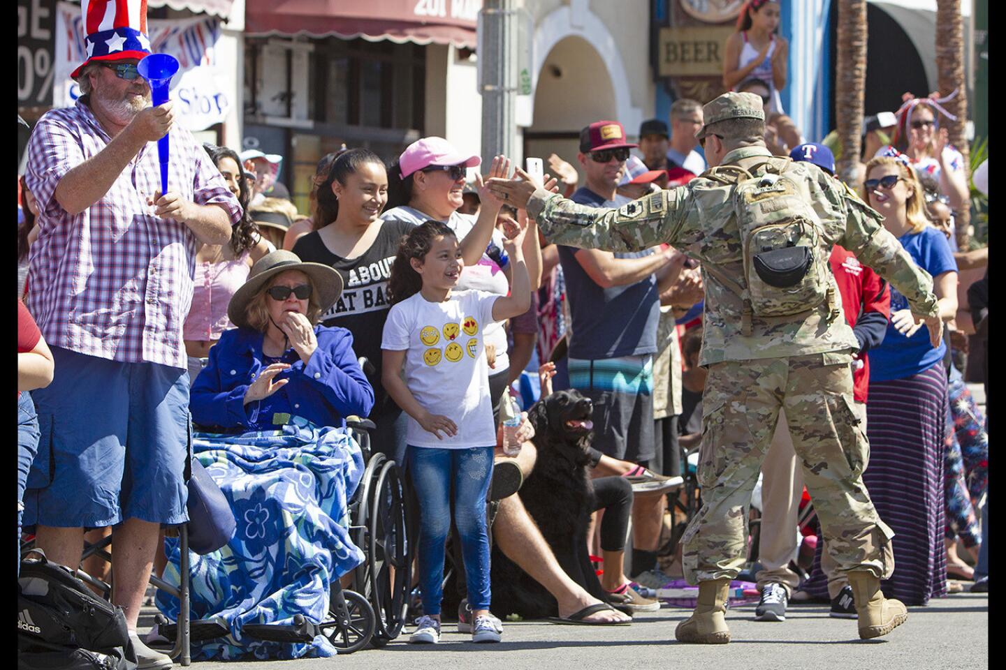 Fourth of July parade in Huntington Beach draws thousands of spectators -  Los Angeles Times