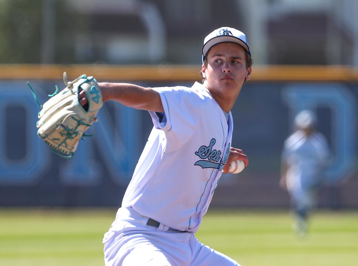 Starting pitcher Stevie Jones (14) of Corona del Mar throws during Battle of the Bay and Surf League game.