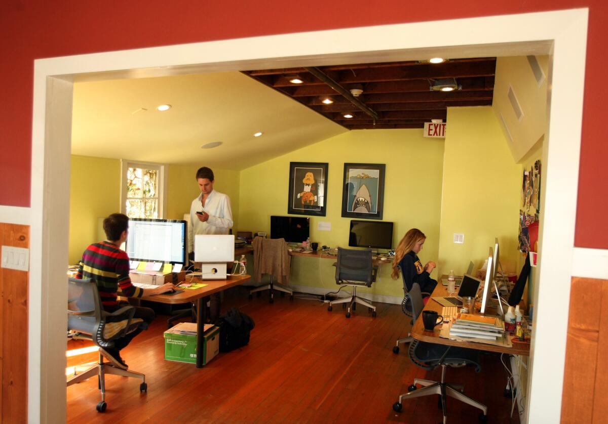 Micha Schaffer, from left, Evan Spiegel and Allison Beck, work at Snapchat headquarters on Ocean Front Walk in Venice on May 6, 2013.