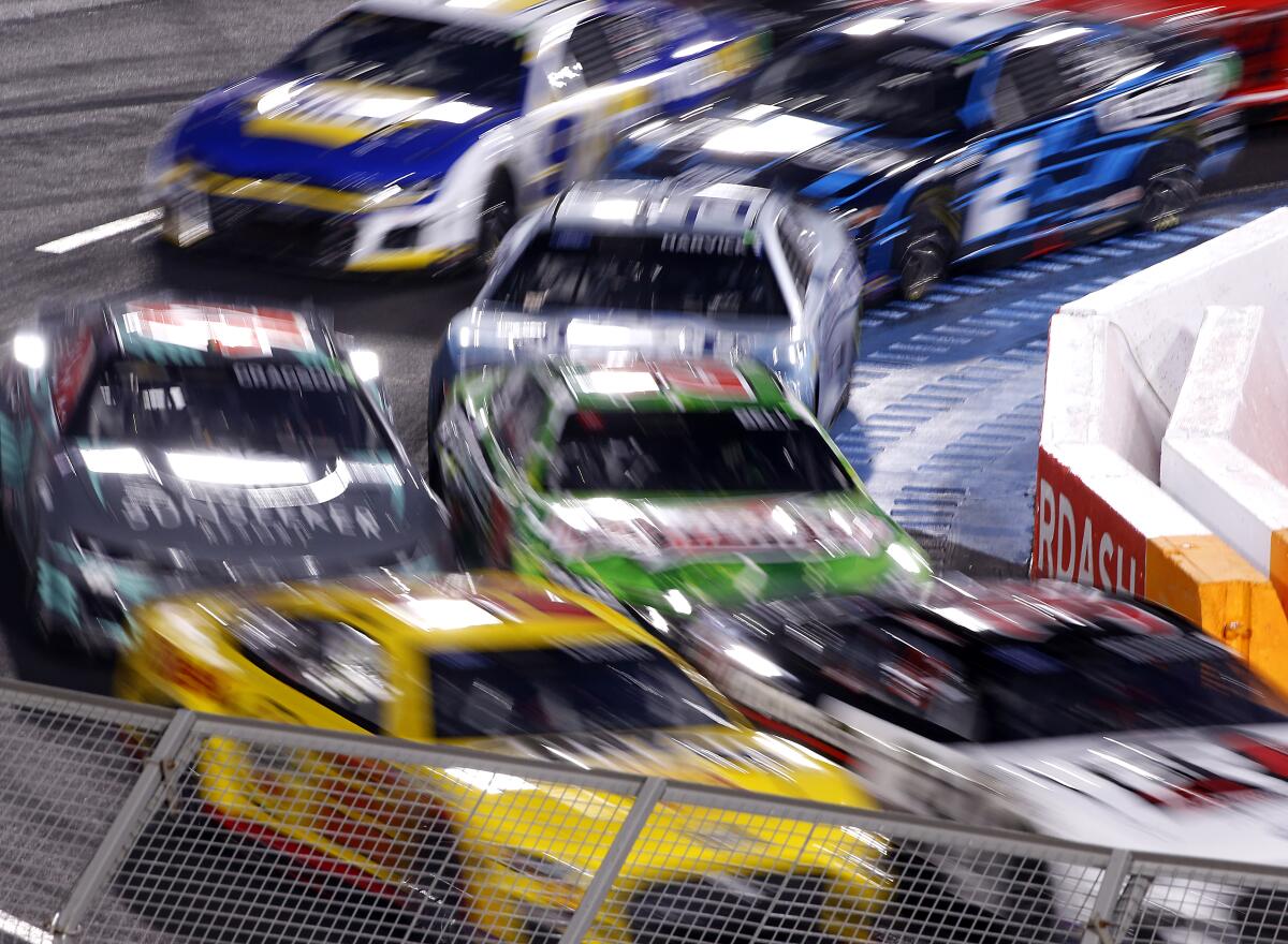 Cars race through one of the turns at the Coliseum during the Busch Light Clash at the Coliseum on Feb. 5, 2023.