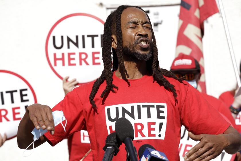 INGLEWOOD, CA - FEBRUARY 11, 2022 - - Local 11 union member Aaron Williams, a bartender at SoFi Stadium, speaks of better wages for workers while joining union members, labor leaders and elected officials who gather to celebrate Local 11's settlement of $30 an hour for workers at SoFi Stadium and a resolution passed to commemorate February 13, 2022 as, "Kenny Washington Day," at UNITE HERE Local 11 in Inglewood on February 11, 2022. Washington was recognized for his trailblazing contributions in breaking the color barrier in the NFL and members of his family were in attendance at the gathering. Local 11 announced its continued efforts for better wages for concessions workers at SoFi Stadium and to fight for good jobs in a region that has predominantly left out black workers. (Genaro Molina / Los Angeles Times)