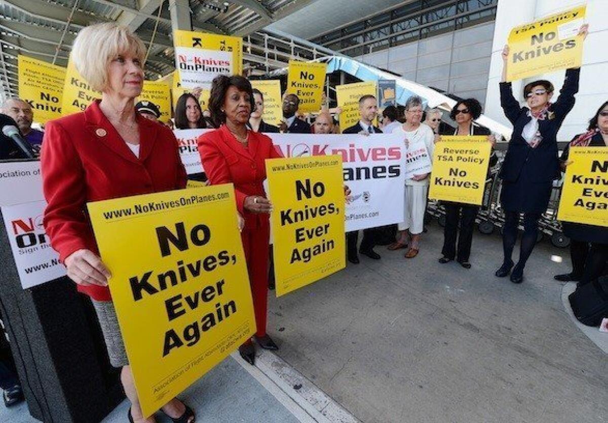Reps. Janice Hahn, left, and Maxine Waters, both Democrats from Los Angeles, participate in an April protest at Los Angeles International Airport of the TSA's plan to allow small knives on planes.