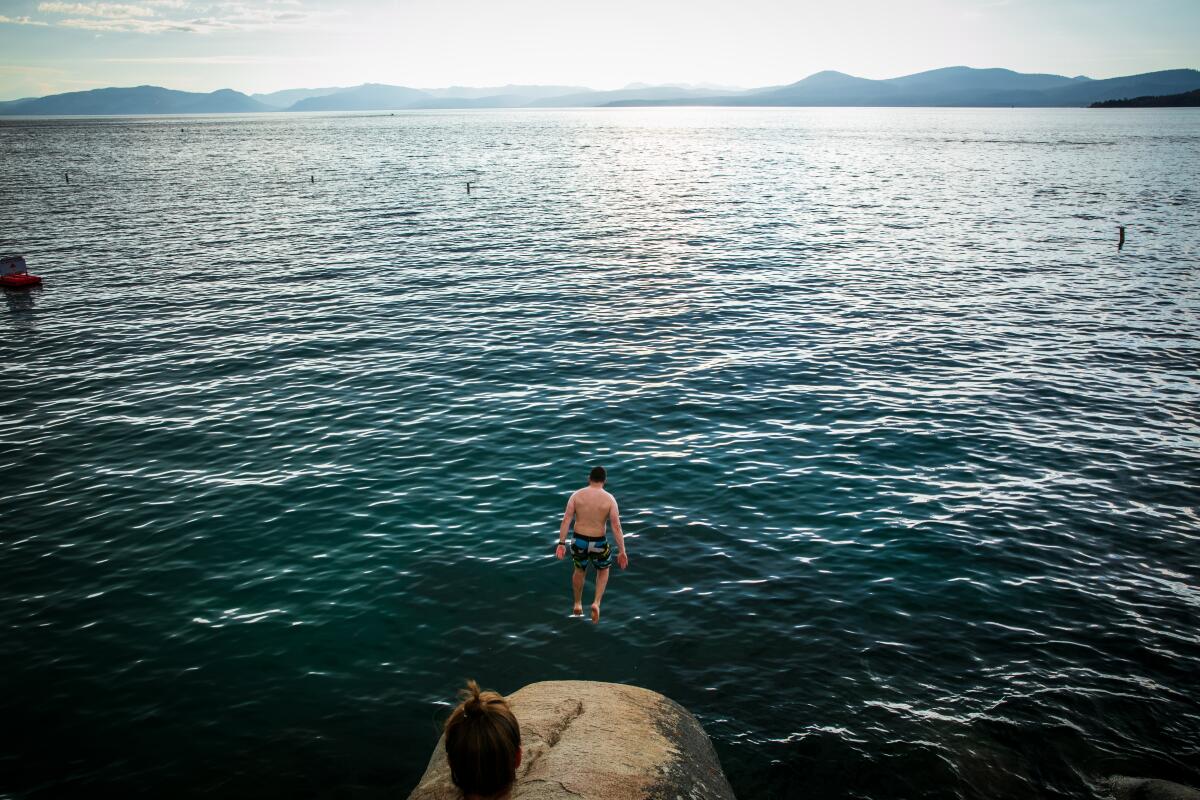 A man jumps into Lake Tahoe on Aug. 27, 2019. 