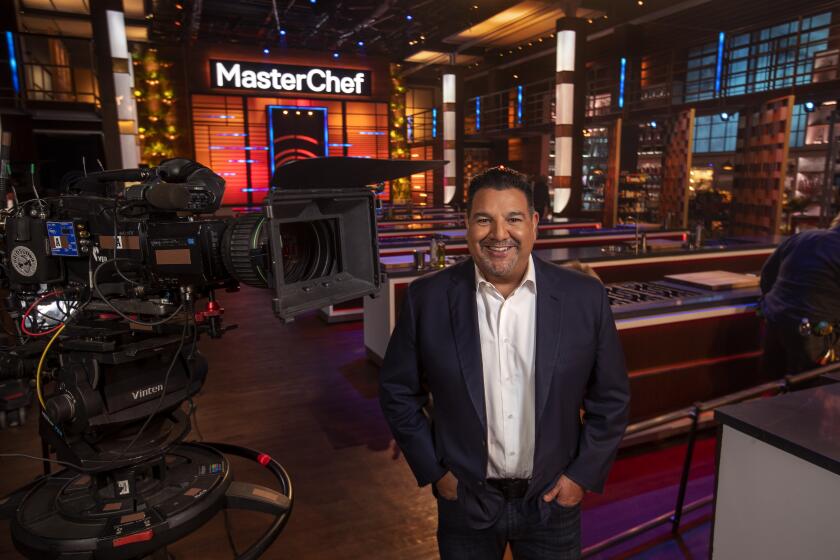 VAN NUYS, CA - OCTOBER 29, 2021: Cris Abrego, the CEO of Endemol Shine Americas, a big reality show production firm, is photographed on the set of one of his shows, MasterChef, at Occidental Studios in Van Nuys. Abrego is one of the few Latinos from (east of) East Los Angeles, who has successfully climbed the corporate ladder in Hollywood. (Mel Melcon / Los Angeles Times)