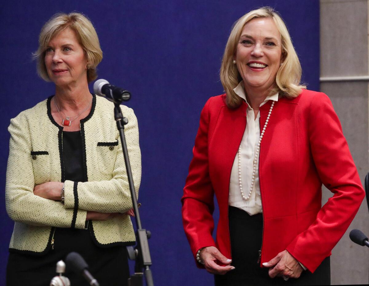 L.A. County Supervisor Kathryn Barger, at right, with Supervisor Janice Hahn, said the county was progressing in its coronavirus fight and would ask the state for to allow it to advance farther into Gov. Gavin Newsom's phased reopening plan.