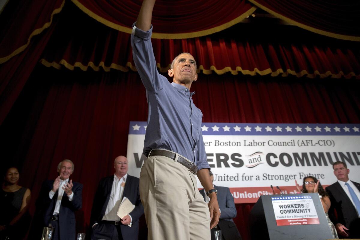 President Obama waves to the crowd after speaking at the Greater Boston Labor Council Labor Day Breakfast on Monday. Obama announced an executive order requiring federal contractors to offer their employees up to seven days of paid sick leave per year.