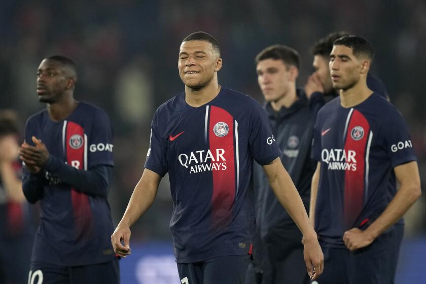 PSG's Kylian Mbappe and his teammates react after the Champions League semifinal second leg soccer match between Paris Saint-Germain and Borussia Dortmund at the Parc des Princes stadium in Paris, France, Tuesday, May 7, 2024. (AP Photo/Christophe Ena)