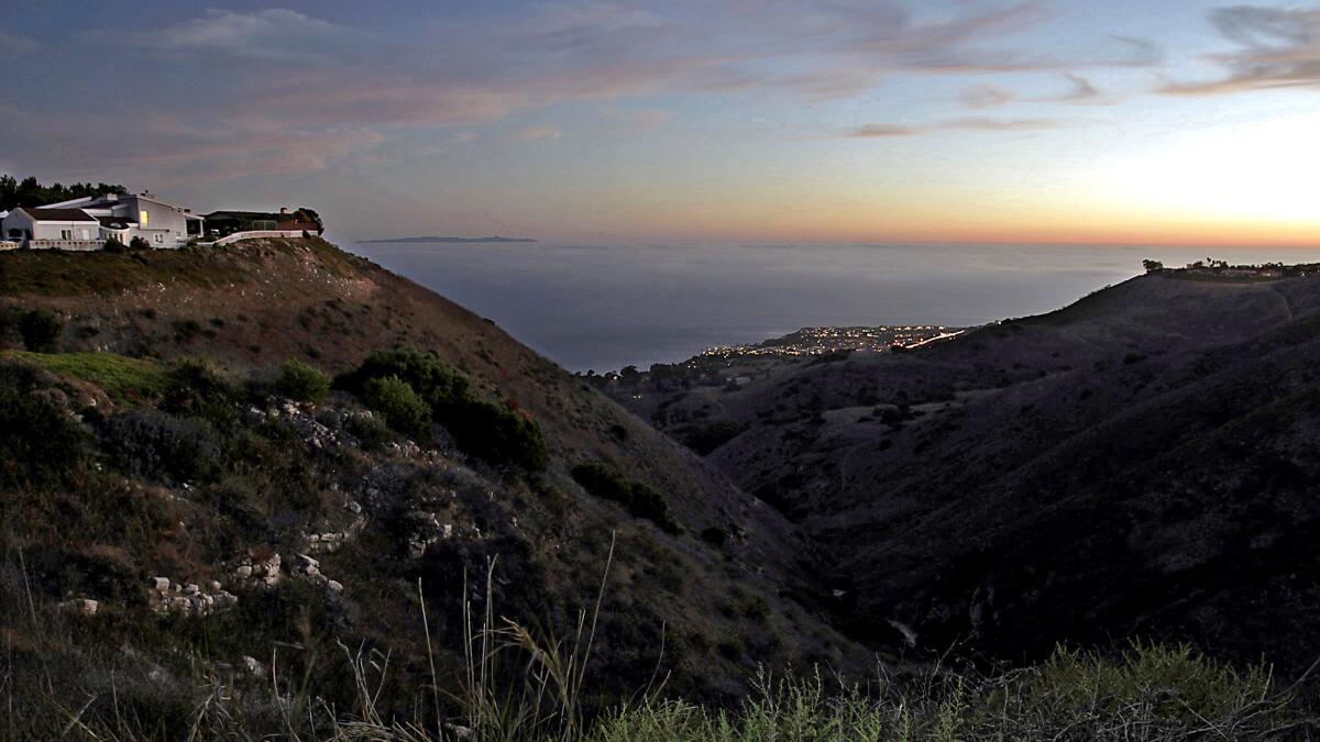 The sun sets on the Pacific Ocean in a view from Del Cerro Park at the southern terminus of Crenshaw Boulevard in the Palos Verdes Peninsula.