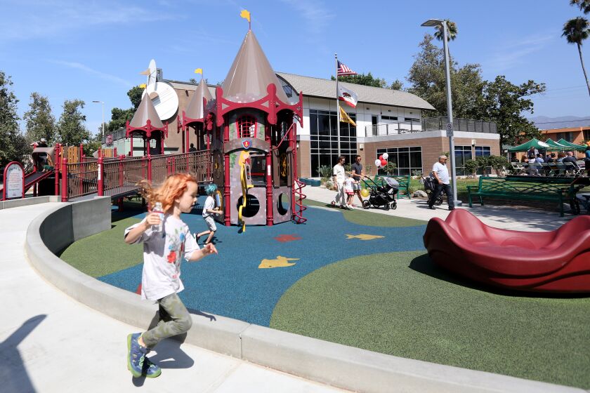 Children play at the new Maple Park all-inclusive playground, in Glendale on Saturday, Aug. 17, 2019. City and other officials held a ceremony to cut the ribbon.