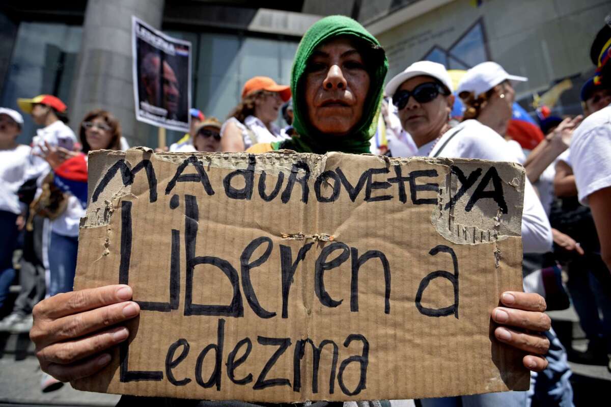 An opponent of the government of Venezuelan President Nicolas Maduro takes part in a march in Caracas to mark International Women's Day.