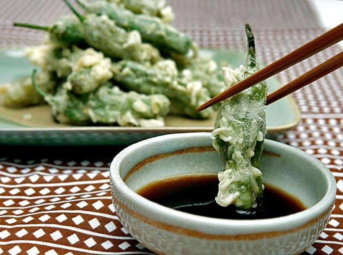 A shishito pepper turned into vegetable tempura gets a flavor boost, courtesy of a sauce.