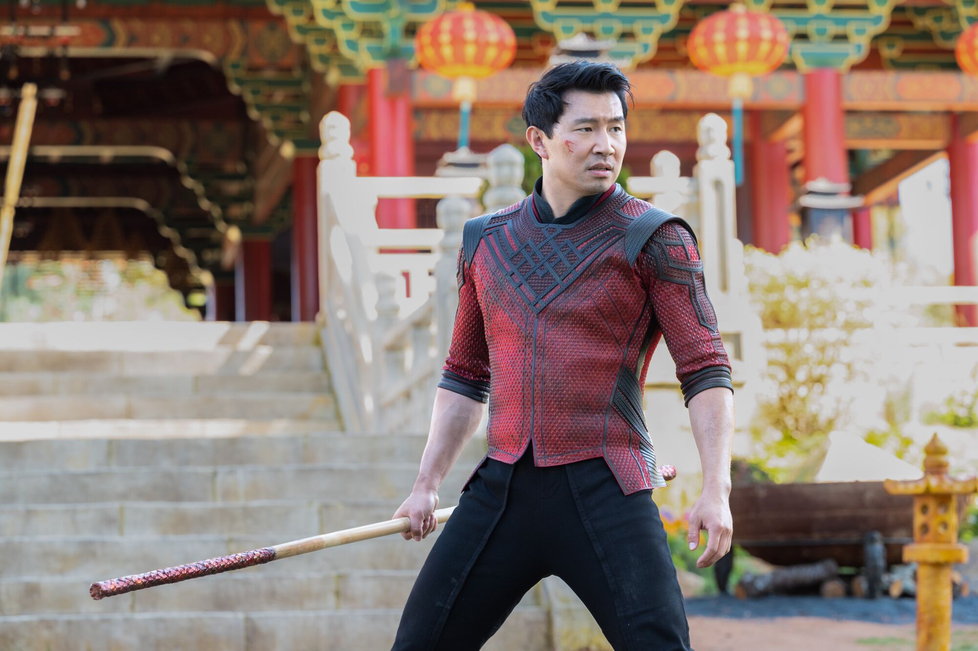 Simu Liu strikes a defiant pose in a scene from "Shang-Chi and the Legend of the Ten Rings."