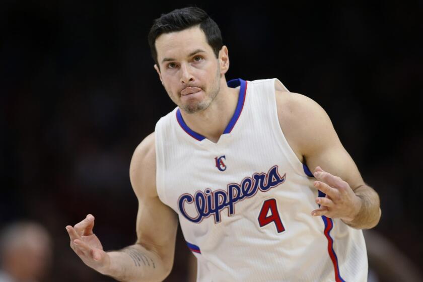 Clippers guard J.J. Redick celebrates after scoring a three-pointer during a 94-86 win over the Memphis Grizzlies at Staples Center on April 11.