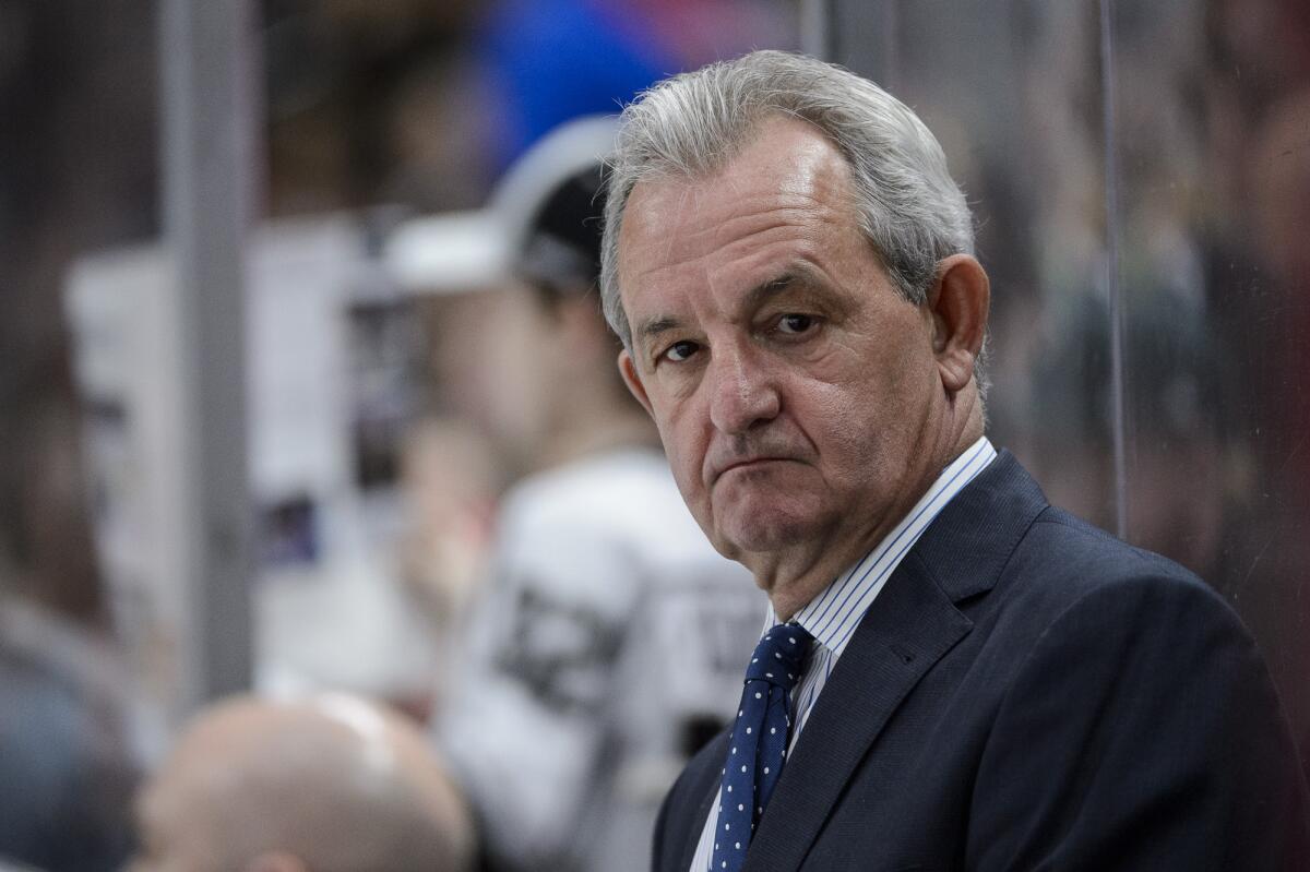 Kings coach Darryl Sutter looks on from the bench during a game against the Minnesota Wild.