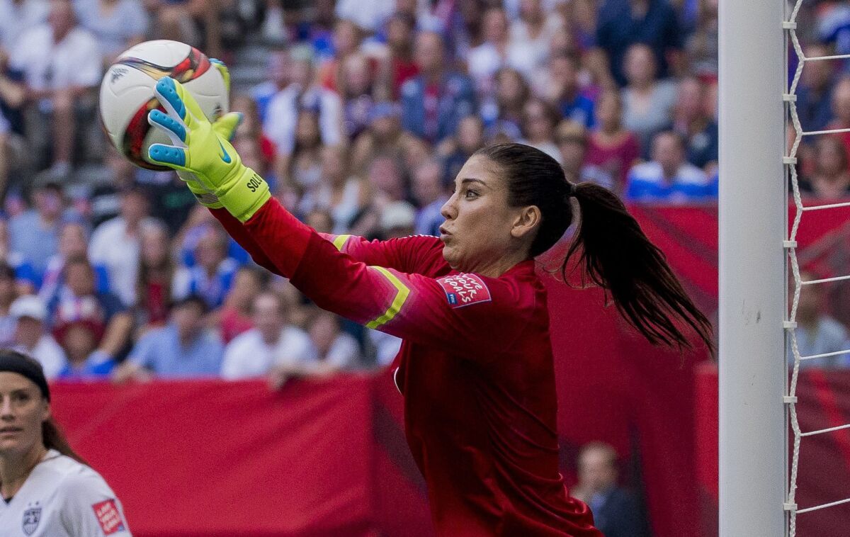 American goalkeeper Hope Solo makes one of her five saves against Japan during the Women's World Cup final on Sunday.