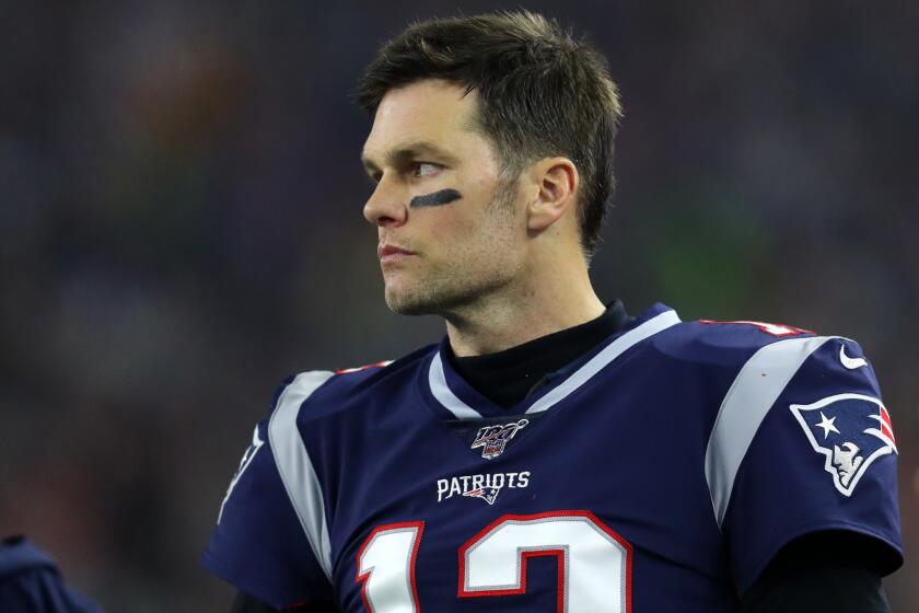 FOXBOROUGH, MASSACHUSETTS - JANUARY 04: Tom Brady #12 of the New England Patriots looks on from the sideline during the the AFC Wild Card Playoff game against the Tennessee Titans at Gillette Stadium on January 04, 2020 in Foxborough, Massachusetts. (Photo by Maddie Meyer/Getty Images)