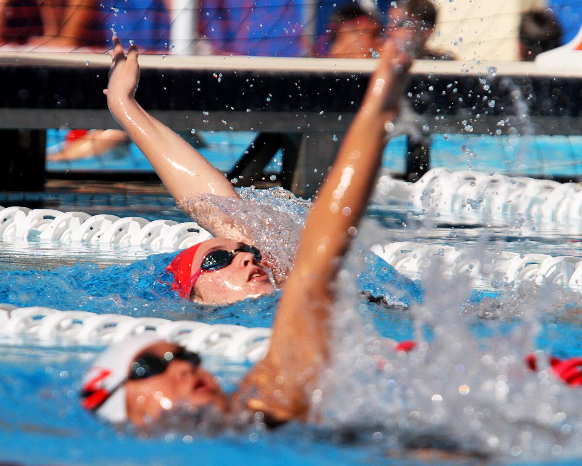 FSHA's Kirsten Vose does the backstroke in the 200 IM ahead of Harvard-Westlake's Sydney Wong in a Mission League swim meet against Harvard-Westlake in at Harvard-Westlake School in Studio City on Tuesday, March 18, 2014.
