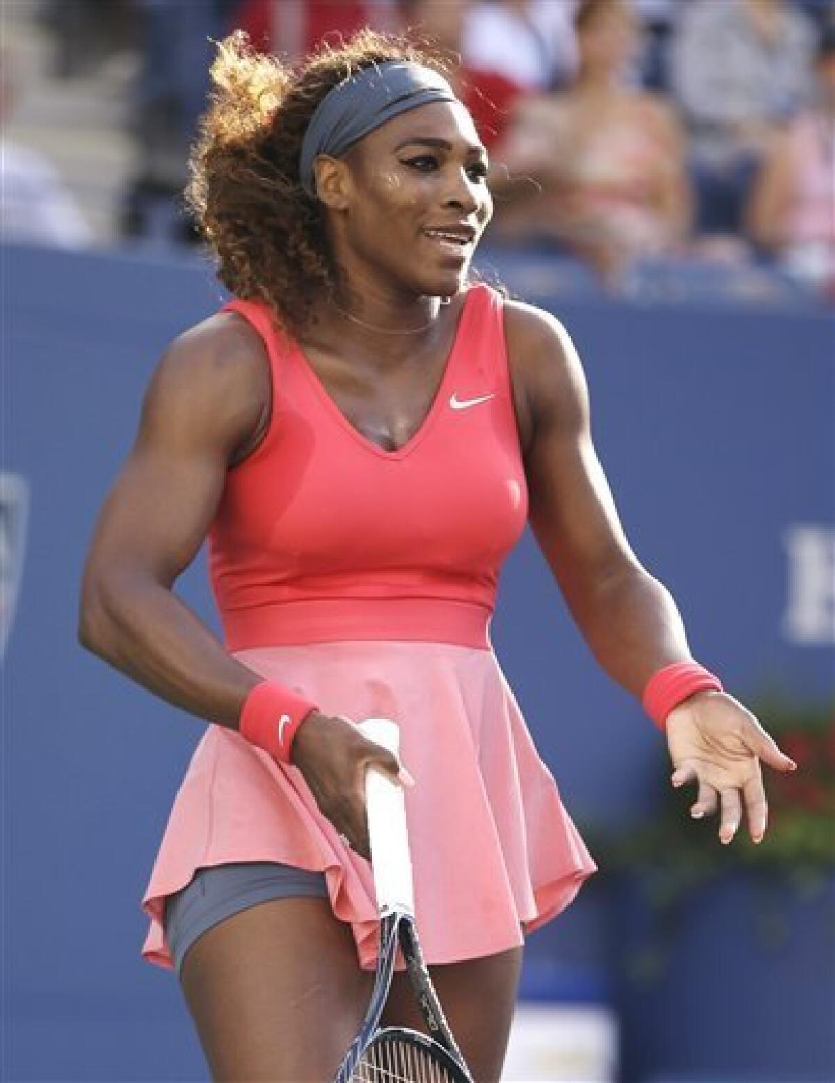 Serena Williams throws her racket after losing the second set tiebreak to  Victoria Azarenka of Belarus in the Woman's Final in Arthur Ashe Stadium at  the U.S. Open Tennis Championships at the