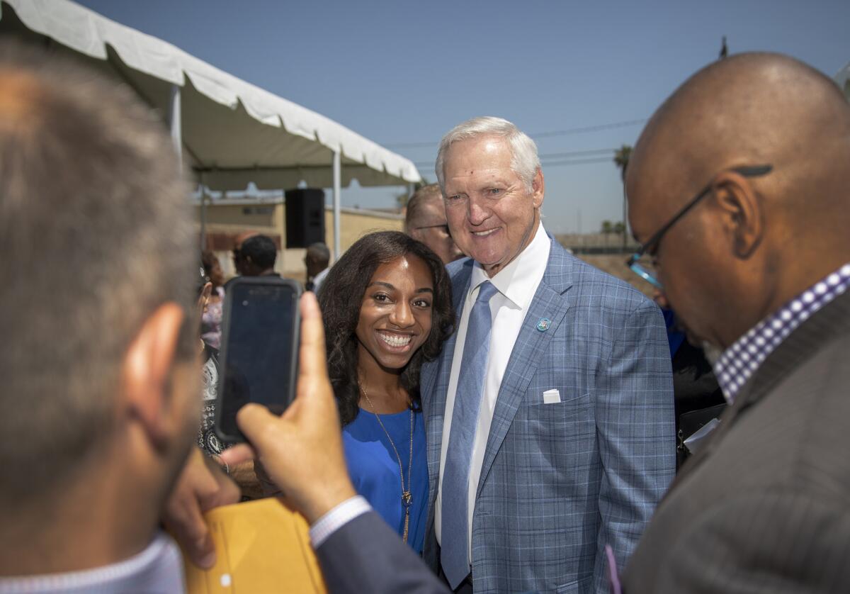 Former Lakers star and current Clippers consultant Jerry West greets guests for a news conference on Tuesday at the Inglewood site where the NBA team plans to build an arena.