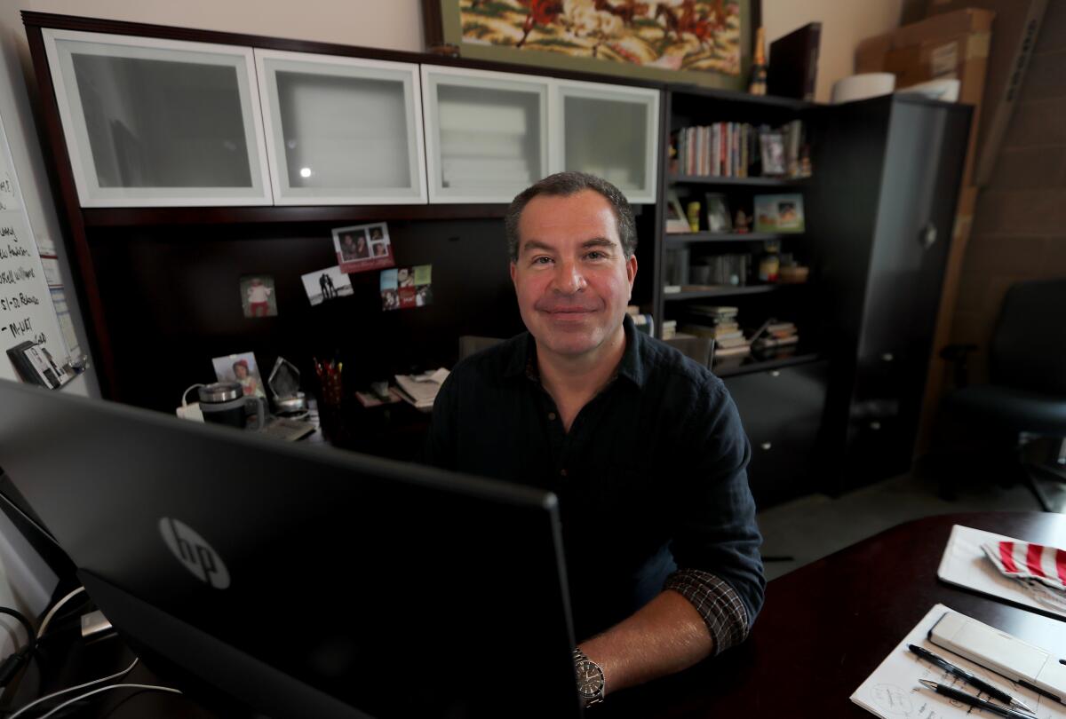 Peter Bohenek, president of a digital marketing company in Irvine, works from his home
