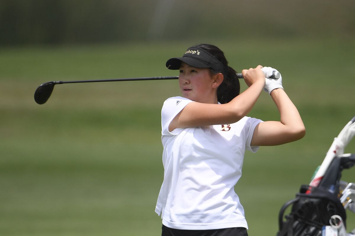 Lucy Yuan of The Bishop's School hits her second shot on the 17th hole during the CIF girls golf finals June 3 in Carlsbad.