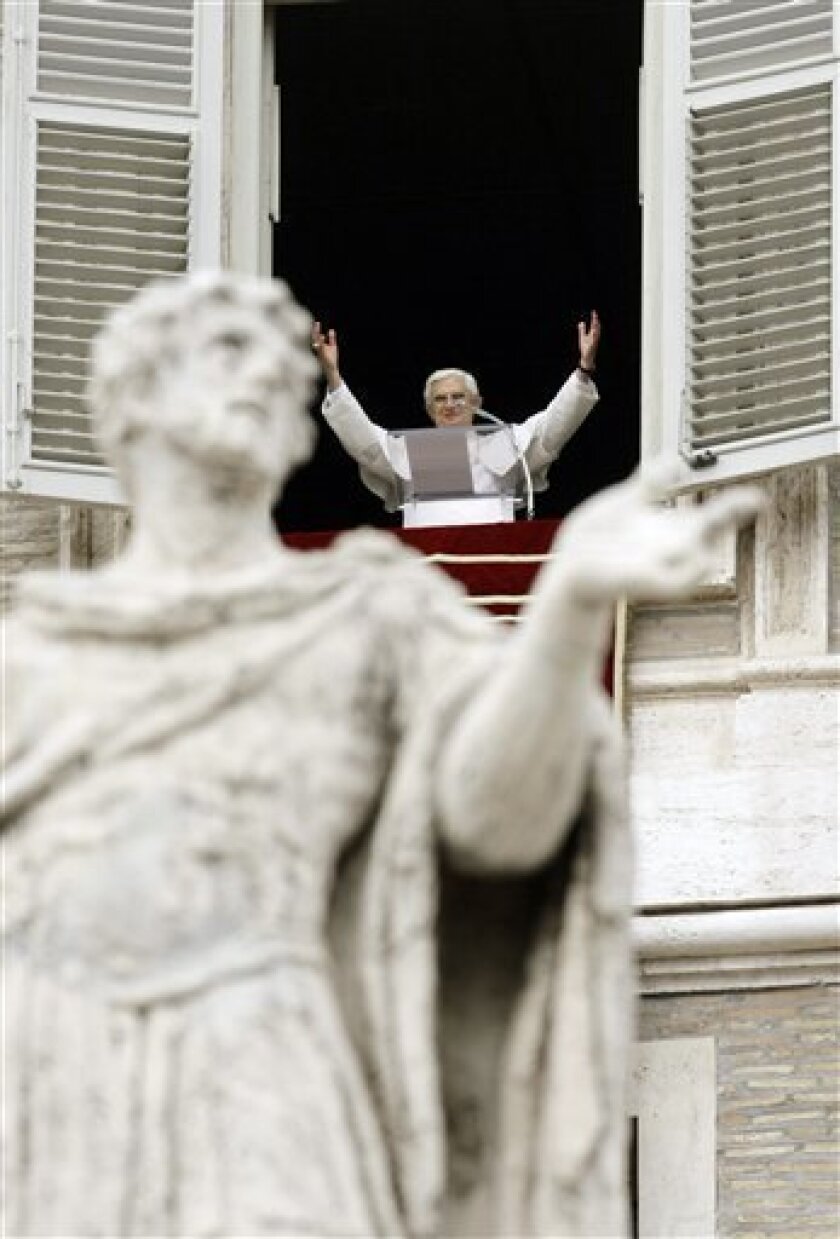 Pope Benedict XVI delivers his message during the Angelus prayers, from the window of his studio overlooking St. Peter's square at the Vatican Sunday, Nov. 23, 2008. (AP Photo/Andrew Medichini)