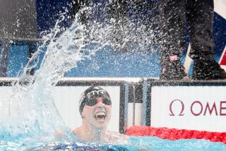 NANTERRE, FRANCE - JULY 31: Katie Ledecky celebrates after winning the womenOs 1500m swimming final at Paris La Defense Arena on Wednesday, July 31, 2024 in Nanterre, .(Wally Skalij / Los Angeles Times)