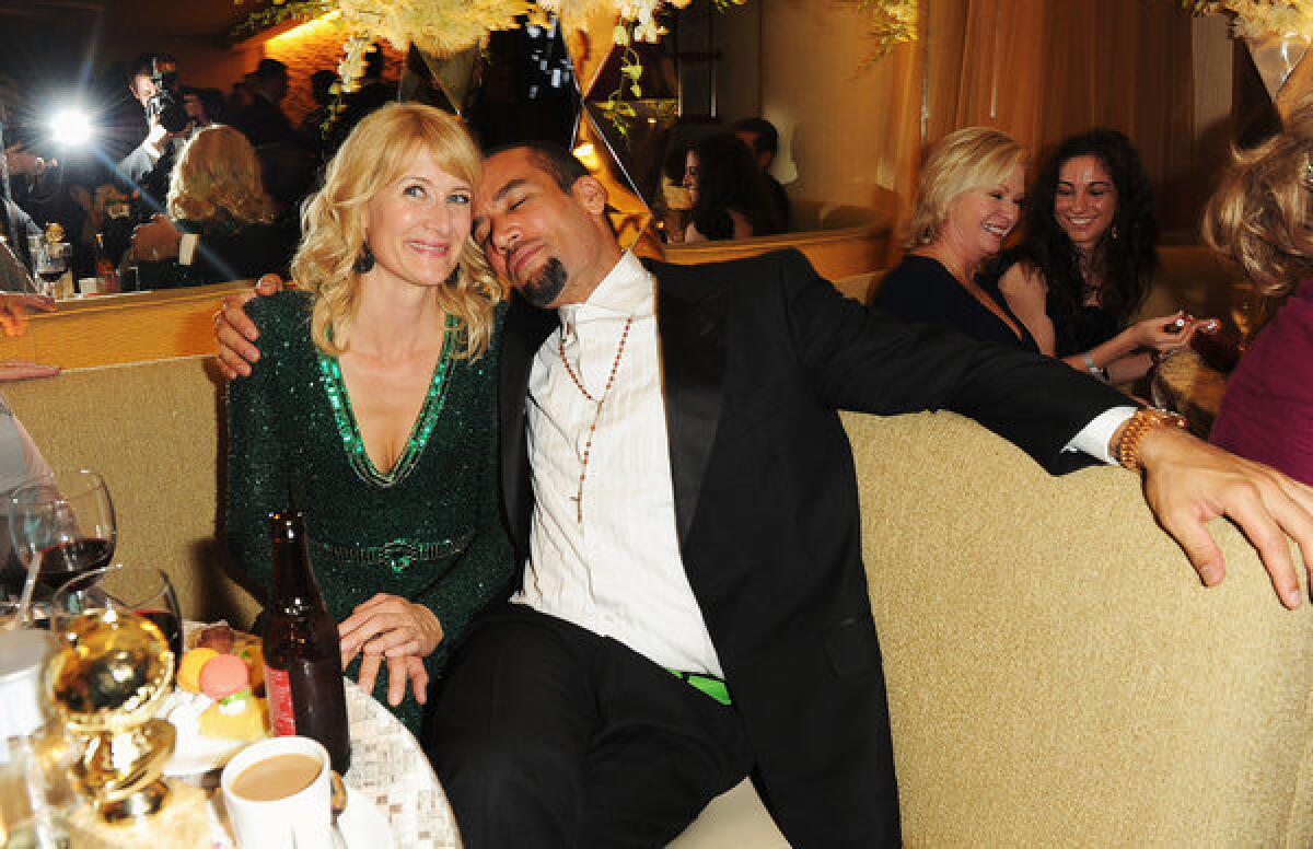 Actress Laura Dern and musician Ben Harper have finalized their divorce. Above, the couple attend HBO's Golden Globe Awards Party at Circa 55 Restaurant on Jan. 15, 2012.