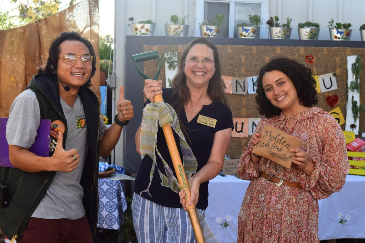 Nam-Huy Leduc and Jessi Goralski with "Golden Pichfork" honoree Tammy Churchill.