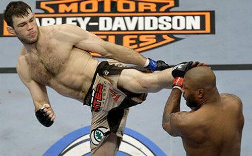 Challenger Forrest Griffin lands a kick against Quinton "Rampage" Jackson during their light-heavyweight championship bout Saturday night. Griffin would win a five-round unanimous decision.