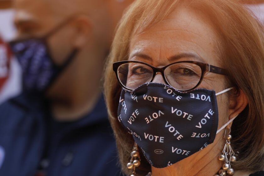 EAST LOS ANGELES, CA - AUGUST 14, 2021 - -California State Senator Maria Elena Durazo makes her statement with her mask and attended a presser with California Gov. Gavin Newsom and other Latino leaders in support of voting no on his recall at Hecho en Mexico restaurant in East Los Angeles on August 14, 2021. Governor Newsom met with volunteers who were working the phone banks calling voters to vote agains the recall at the restaurant. Los Angeles City Councilman Kevin de Leon, California Assemblyman Miguel Santiago and other dignitaries were on hand to support the governor. (Genaro Molina/Los Angeles Times)