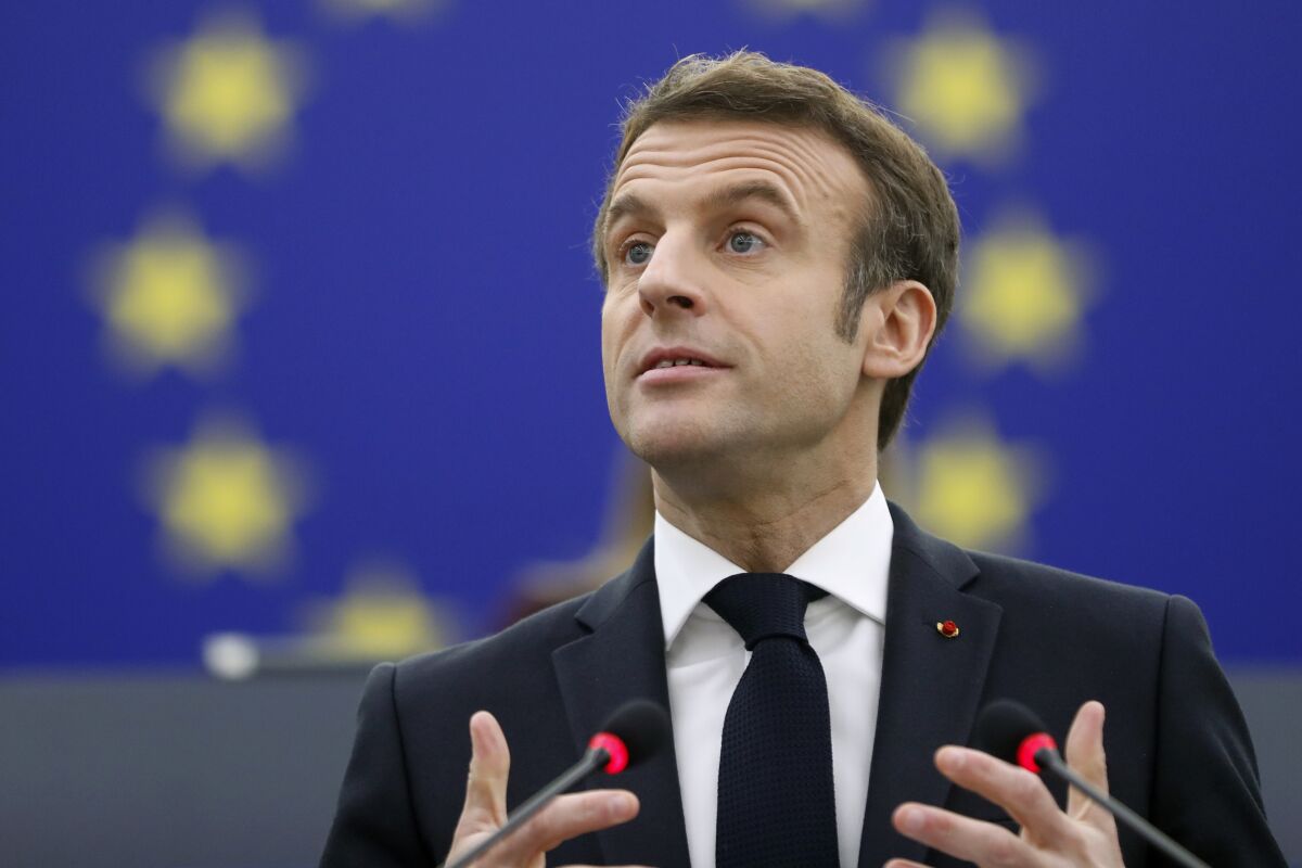 French President Emmanuel Macron delivers a speech at the European Parliament Wednesday, Jan. 19, 2022 in Strasbourg, eastern France. (AP Photo/Jean-Francois Badias)