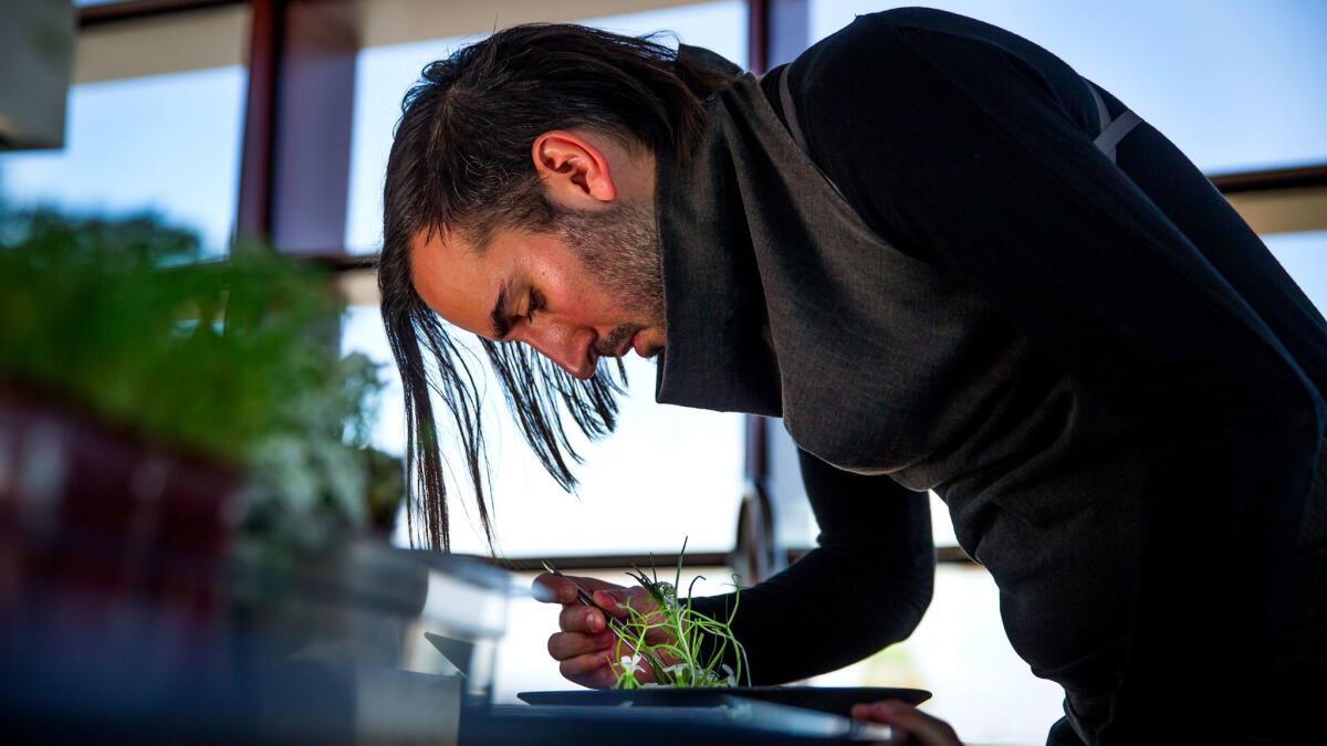 Vespertine chef Jordan Kahn plates a live scallop dish at his restaurant in Culver City.